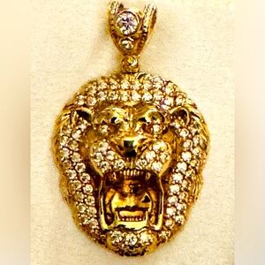 10kt solid gold Lion head pendant accented with over 30 individual CZ stones